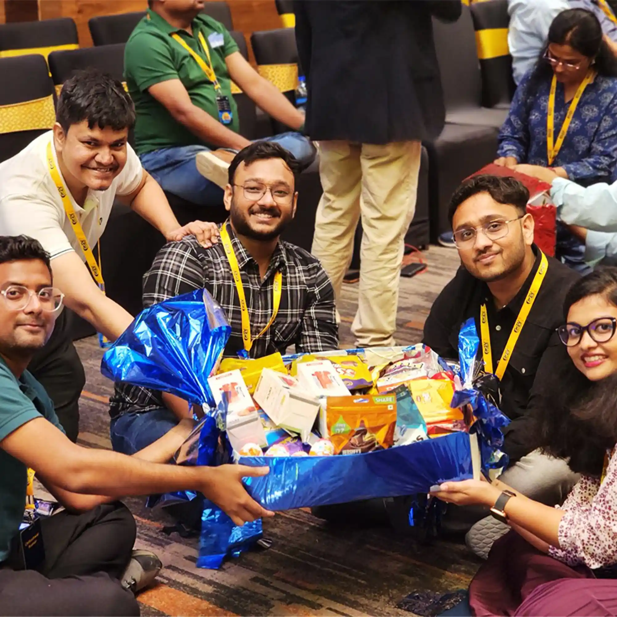 A diverse corporate team celebrating together after a successful team building activity in Bareilly.